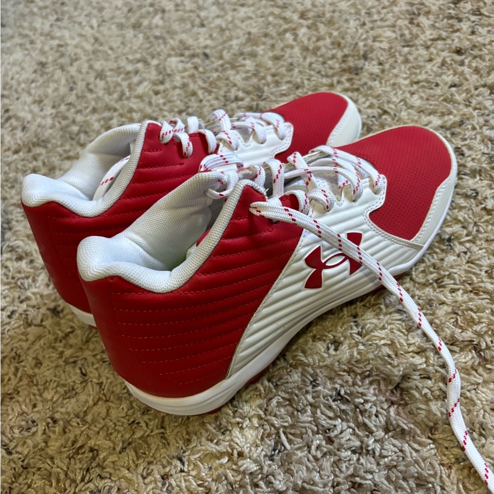 Under armor plastic softball cleats.
